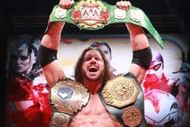 Mundo with three of AAA's most prestigious title belts
